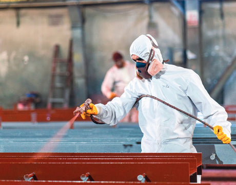 Man spraying steel