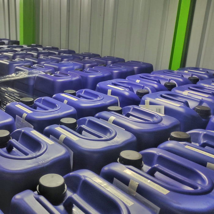 Pallets of Blue plastic drums